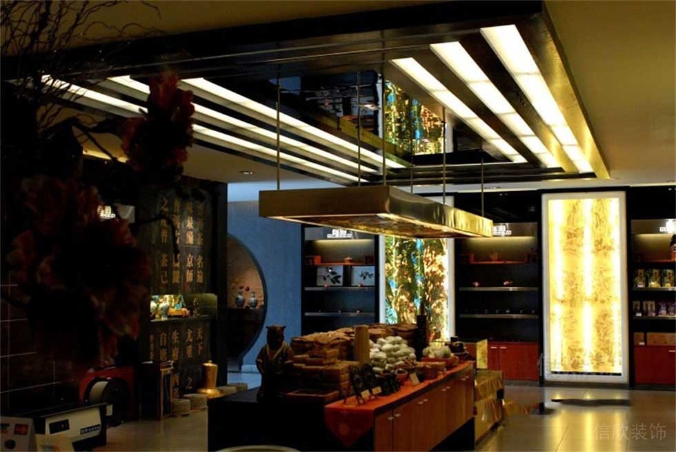 書(shū)店售賣(mài)區(qū)域茶葉裝修效果圖鎏金金屬暗色中式風(fēng)店鋪裝修