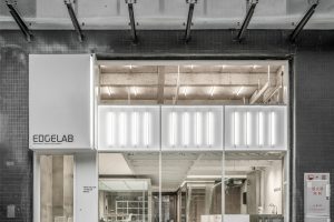 灰白色工業(yè)風辦公室裝修設計灰白色外立面門頭形象效果圖